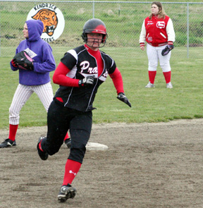 Kara Guyer heads for third with a triple in the C.V. game.