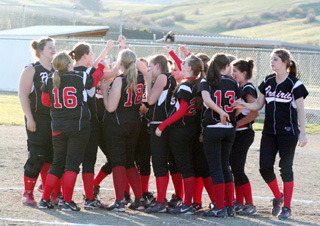 The Lady Pirates celebrate their win against Troy that sent them to State.