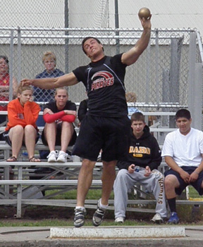 Kyler Shumway as he prepares to launch his 60 foot throw in the shot put.