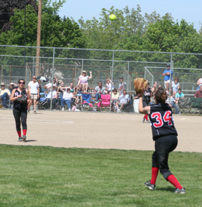 Alena Hoene catches a fly ball in right for the final out of the championship game.