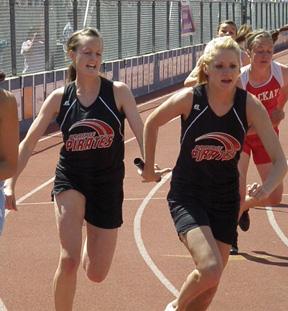 NaTosha Schaeffer hands off to Katie Nuxoll in one of the 3 relays that those two along with Kristin Hill and MaKayla Schaeffer placed 2nd in.