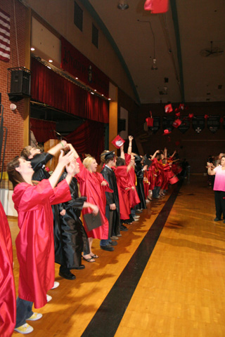 Hats went flying after the ceremonies were over.