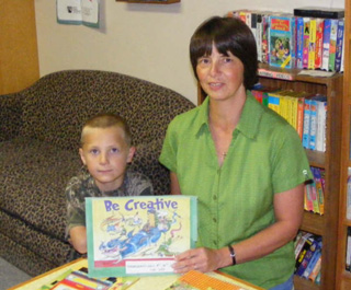 Aleta Coppernoll, shown with her son Matt, has been named Prairie Community Librarys Volunteer of the Month for June.
