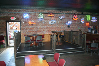 The new bandstand area which also doubles as seating area when theres no band. Also seen is the original brick wall.