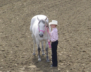 Abbie Uhlenkott, a member of the Cottonwood Saddliers 4-H Club, showing her horse during the Junior Fitting & Showing Class