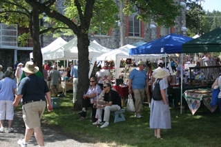 The arts and crafts and vendor booths were busy at the Raspberry Festival Sunday.