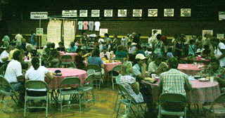 Everyone was enjoying the raspberry shortcake or other food available in the high school gym.