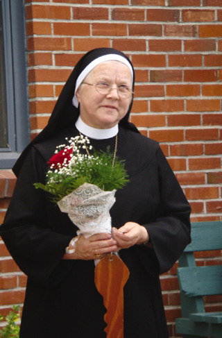 Abbess Pia Habermacher was presented with roses and the symbolic key to the Monastery of St. Gertrude.