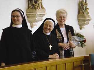 From left - Sister Rut Maria Buschor and Abbess Pia Habermacher, Sarnen, Switzerland, tour the monastery chapel with Sister Clarissa Geockner, prioress.