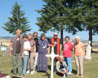 SMHC NOSDA members at the burial service for Teresa Sanford (l-R) Elaine Schumacher, Marie Sprute, Anna Gehring, Sally Terhaar, Sr. Corinne Forsman, Fr. Eamonn McNerney, Jeanette Kelley, Dolores Von Bargen. Ground: Helen Huntley.