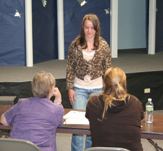 Monica Lustig answers judges questions about her sewing project.