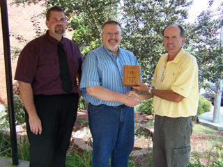 George Hager, center, is presented the Support Person of the Year award from the Engineering and Technology Education Association of Idaho by Jerry Richardson. At left is PHS principal Todd Shumway.