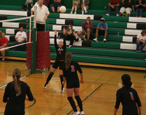 Megan Sigler sets the ball for Casey Bruegeman, 2, as Sammy Frei, 3, and Francesca Johnson, 1, watch.