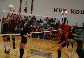 Meaghan Bruner hits the ball past the Kamiah blockers as from left Casey Bruegeman, Gina Seubert and Francesca Johnson watch.