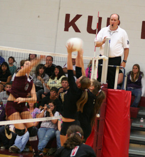 Casey Bruegeman and Shelby Duman block a Kamiah spike attempt. At bottom of photo is Meaghan Bruner.