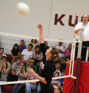 Kayla Johnson fists the ball over the net against Kamiah.