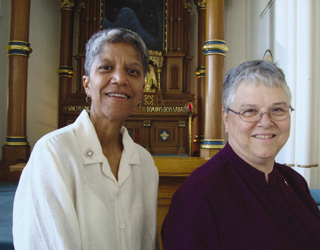 Sisters Carlotta Maria Fontes (left) and Miriam Mendez in the Monastery of St. Gertrude chapel.
