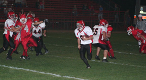 Brock Heath had a huge hole to run through as he goes for a 33 yard touchdown on this play. #44 is Joe Schumacher and #25 is JC Enriquez.