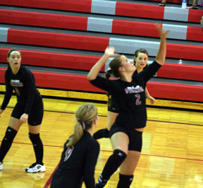 Casey Bruegeman goes up for a spike at C.V. Also shown from left are Megan Sigler, Shelby Duman and Meaghan Bruner.