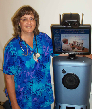 Diane Gardner, RN, with the RP-7 robot.