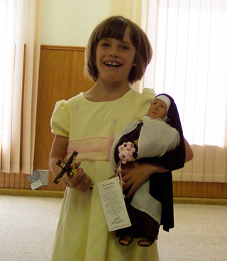 Emma Watson of Craigmont was born with congenital heart disease which made her eligible to receive a wish from the Make-A-Wish Foundation. She is shown with a St. Therese little flower doll donated by the women of St. Thereses Church in Orofino. Her main wish was to receive a special audience and spiritual blessing from the Pope. There is a welcome home party at the Prairie Caf in Craigmont  Saturday after her fulfillment of that wish.