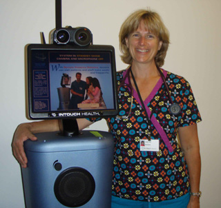 Judy Gehring, RN, with the RP-7 robot.