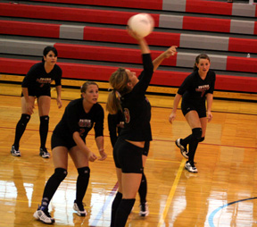 Shelby Duman spikes the ball at C.V. Others from left are Francesca Johnson, Casey Bruegeman, Megan Sigler (behind Shelby) and Meaghan Bruner.
