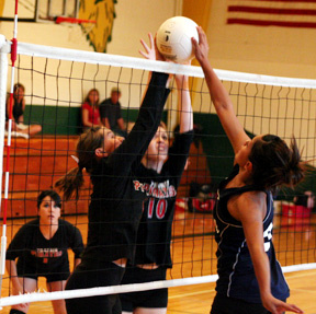 Megan Sigler and Kayla Johnson combine to stuff a Lapwai spike in their match at Culdesac last Thursday.