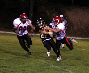 Conner Rieman tackles the Timberline quarterback for a 10 yard loss as Kyler Shumway moves in to help if needed.