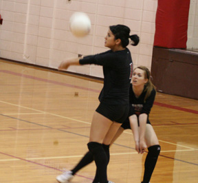 Francesca Johnson passes a Troy serve as Kayla Johnson was ready in case she didnt get it.