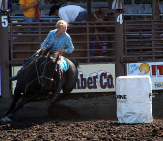 Kelsey Tidwell riding the barrels.