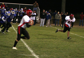 Devin Schmidt wrapped up the first quarter with an interception return for a touchdown. At right is Kyler Shumway.