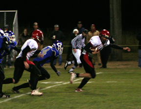 This is right after the photo at left as Devin Schmidt broke loose from the defense and went for a 21 yard gain.