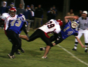 Kyler Shumway puts a pass rush on the Genesee quarterback. He fumbled on the play and Conner Rieman scooped up the fumble and scored.