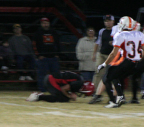 David Sigler recovers an onside kick in the first quarter.