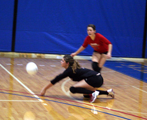Sam Frei digs up a Lapwai serve as Ashley Shumway watches.