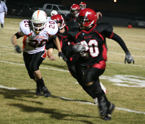 Tyrell Langston goes around left end on his way to a 28 yard gain against Troy.