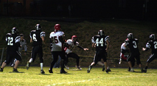 All 6 Deary defenders shown (the sixth is behind #44) plus one already left in his wake took their shot at tacklng David Sigler on a 12 yard end around touchdown run. Also shown is J.C. Enriquez, #25.