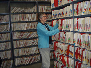 Pam McBride, CVHC/SMHC grants coordinator and EHR project manager, views paper medical records. St. Marys and Clearwater Valley Hospitals have laid the groundwork for the transition to electronic health records.