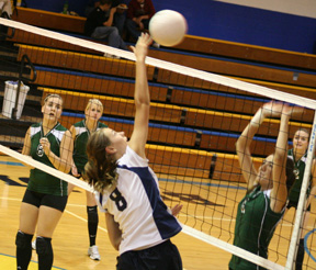 Savanah Prigge spikes the ball against Culdesac.