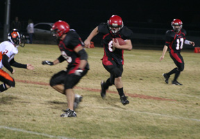 Kyler Shumway prepares to make the block that springs Branden Waller around the corner for a game-ending 45 yard touchdown run. At right is Kyle Holthaus.