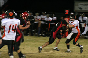Kyler Shumway blocks a Kendrick defender as Branden Waller comes up behind him with the ball.