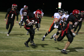 Tyrell Langston follows the lead block of Kyler Shumway for a big gain. In the background are David Sigler, 1; Kyle Holthaus, 17, and at far right, Branden Waller, 6.