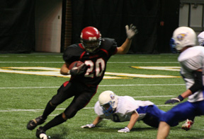 Tyrell Langston, who carried 19 times in the game, makes a cut to get past a Raft River defender on an end run.