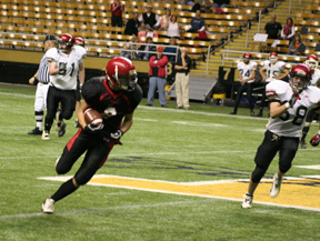Conner Rieman turns upfield as he would score the game's first points on this play, a 60 yard TD pass.