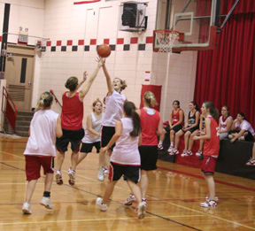 Tanna Schlader attempts to block Francesca Johnson’s shot in a JV vs. Varsity scrimmage Monday at practice.