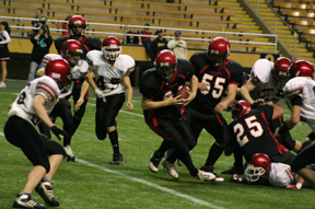 Garrett Roush scored his first varsity points as he ran in Prairie's final 2-point conversion. #55 is Josh Roeper and #25 is J.C. Enriquez.
