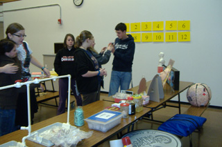 Kyle Uhlenkott, Brianne Lockhart, Brittney Hammond and Ashley Shumway look at activities during the teen tobacco training.