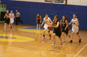 Francesca Johnson heads for the hoop after stealing the ball. Other Prairie players from left are Megan Sigler, MaKayla Schaeffer and Meaghan Bruner.