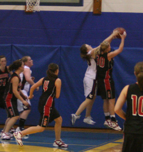 Mary Shears grabs a defensive rebound and gets fouled. Also shown from left are MaKayla Schaeffer, Haleigh Schmidt, Meaghan Bruner and Megan Sigler.